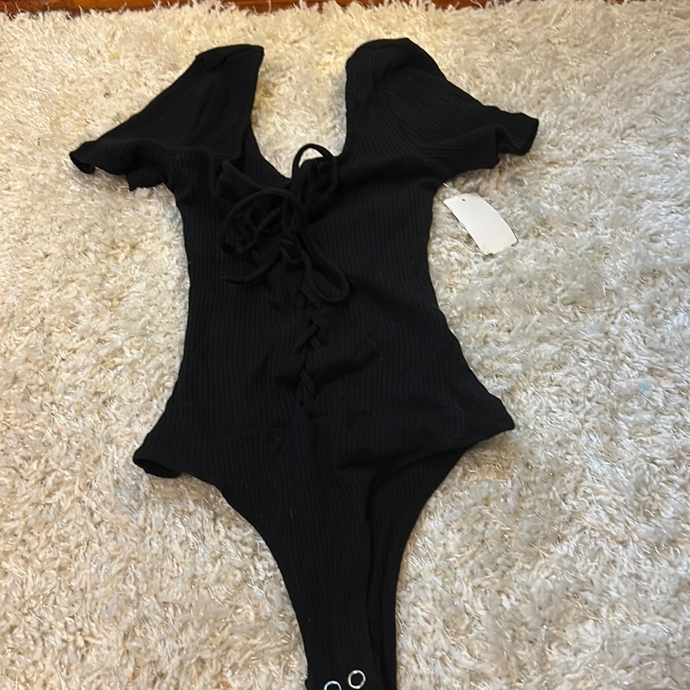 Black bodysuit that ties up! has never been worn, and in great condition!